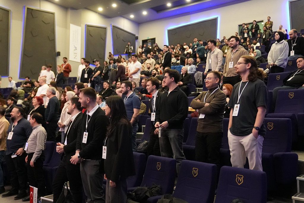 Attendees on their feet in the hall at AgentCon Istanbul